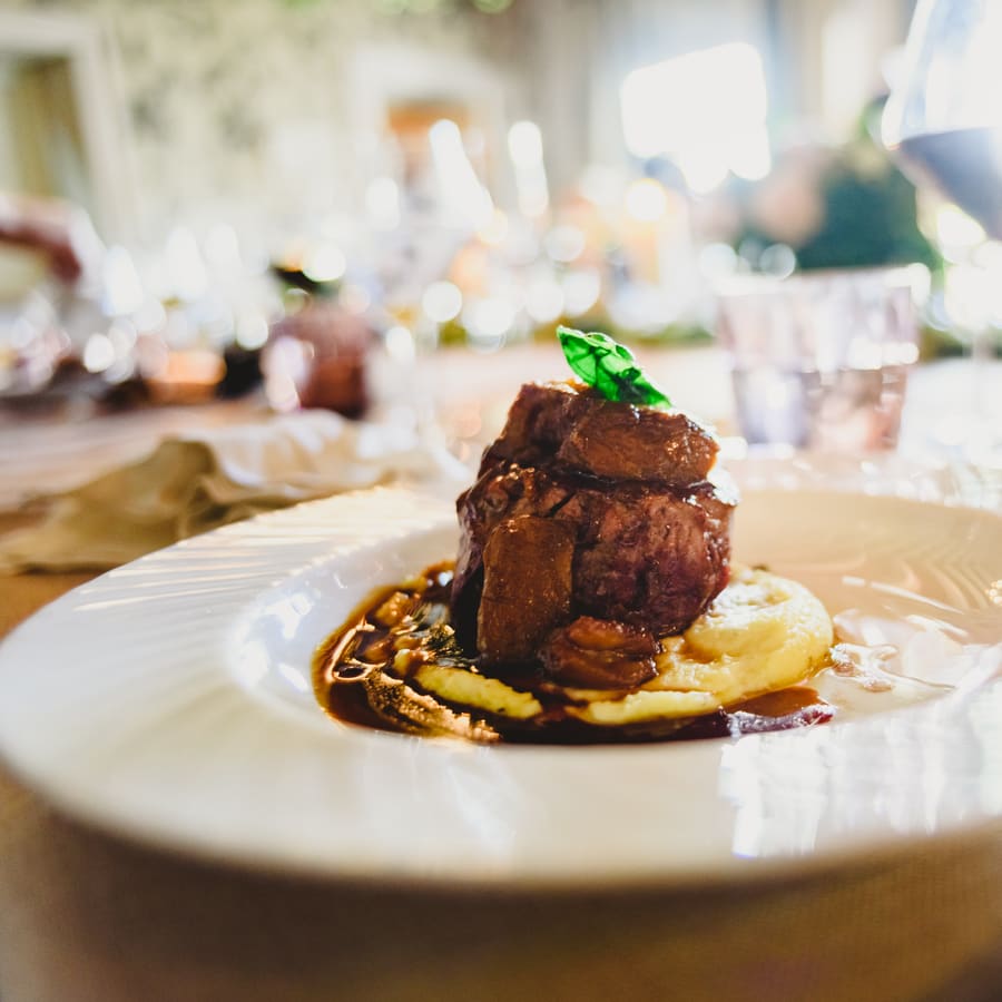 A plated main course on the pass