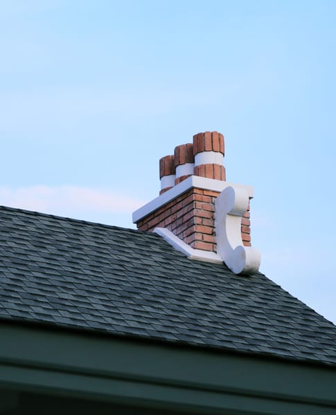 Chimney flashing on a shingle roof