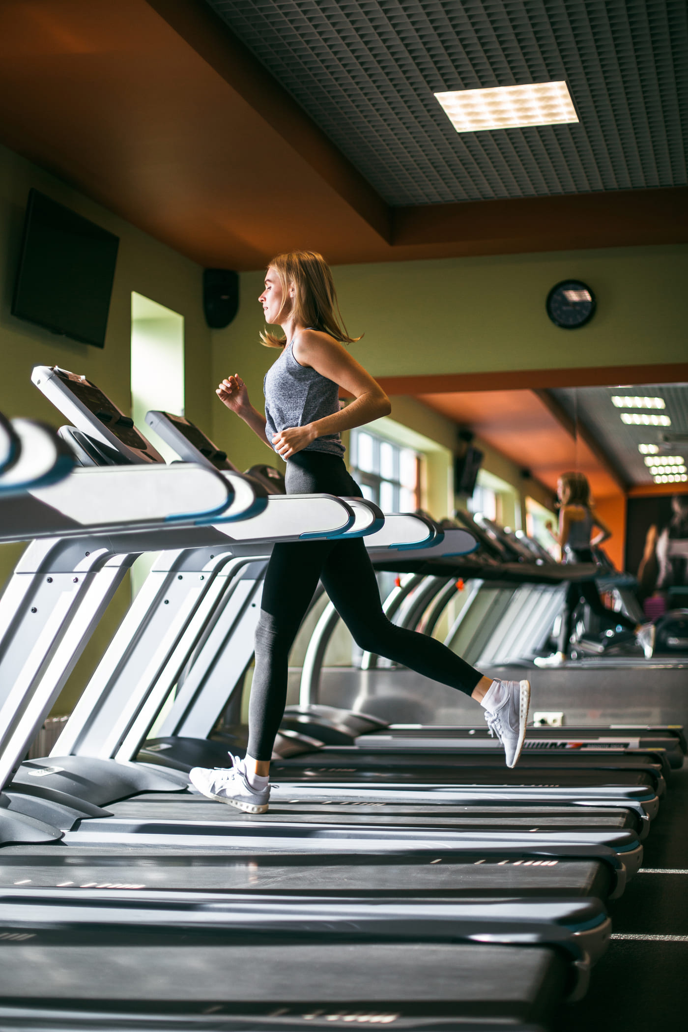 A member running intervals on the treadmill row