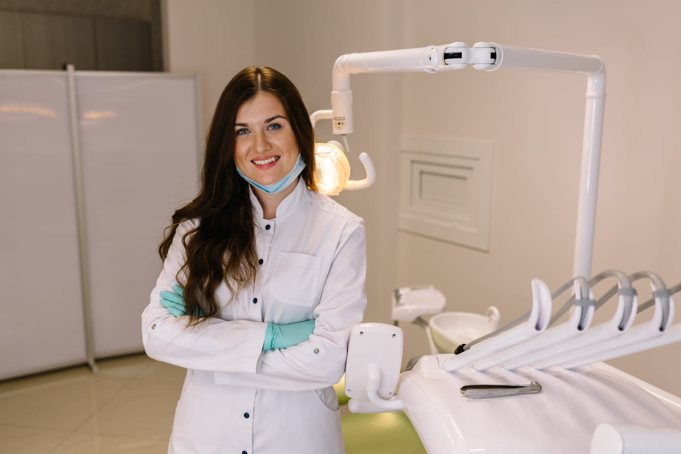 Dr. Maren Kolvig standing beside the chair in her Winter Garden operatory