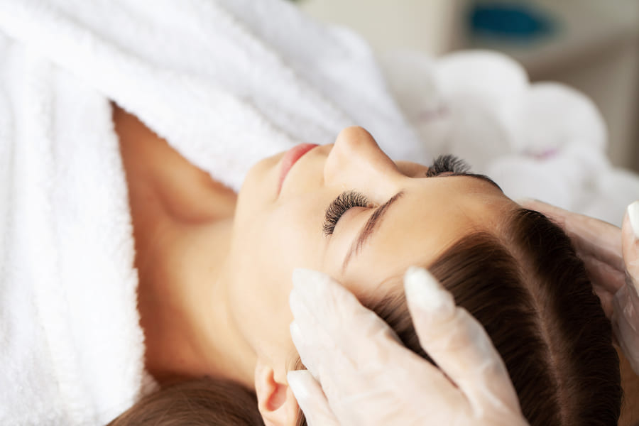 A provider carrying out a facial treatment in the studio