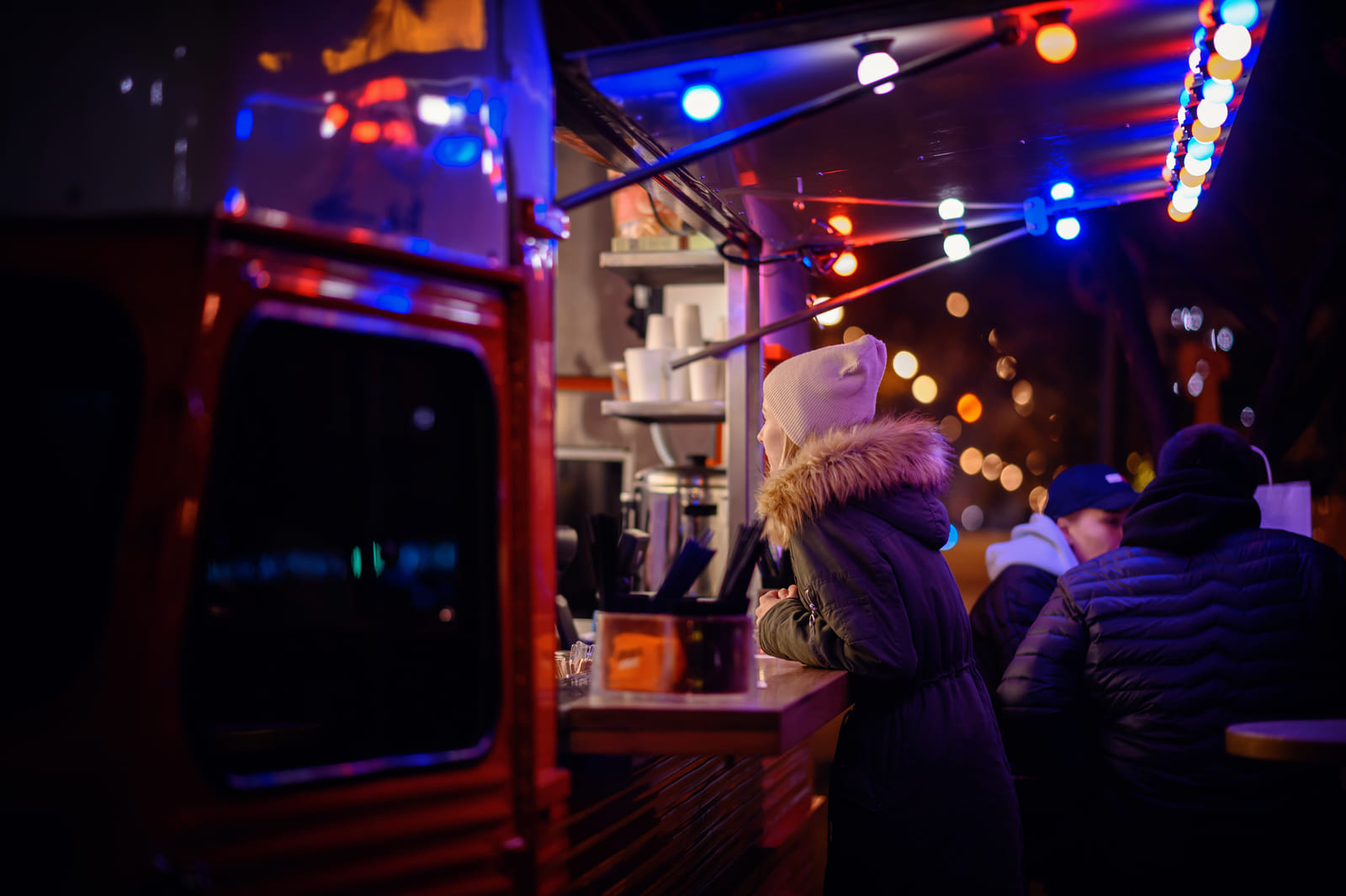 The Taco Truck under string lights at night