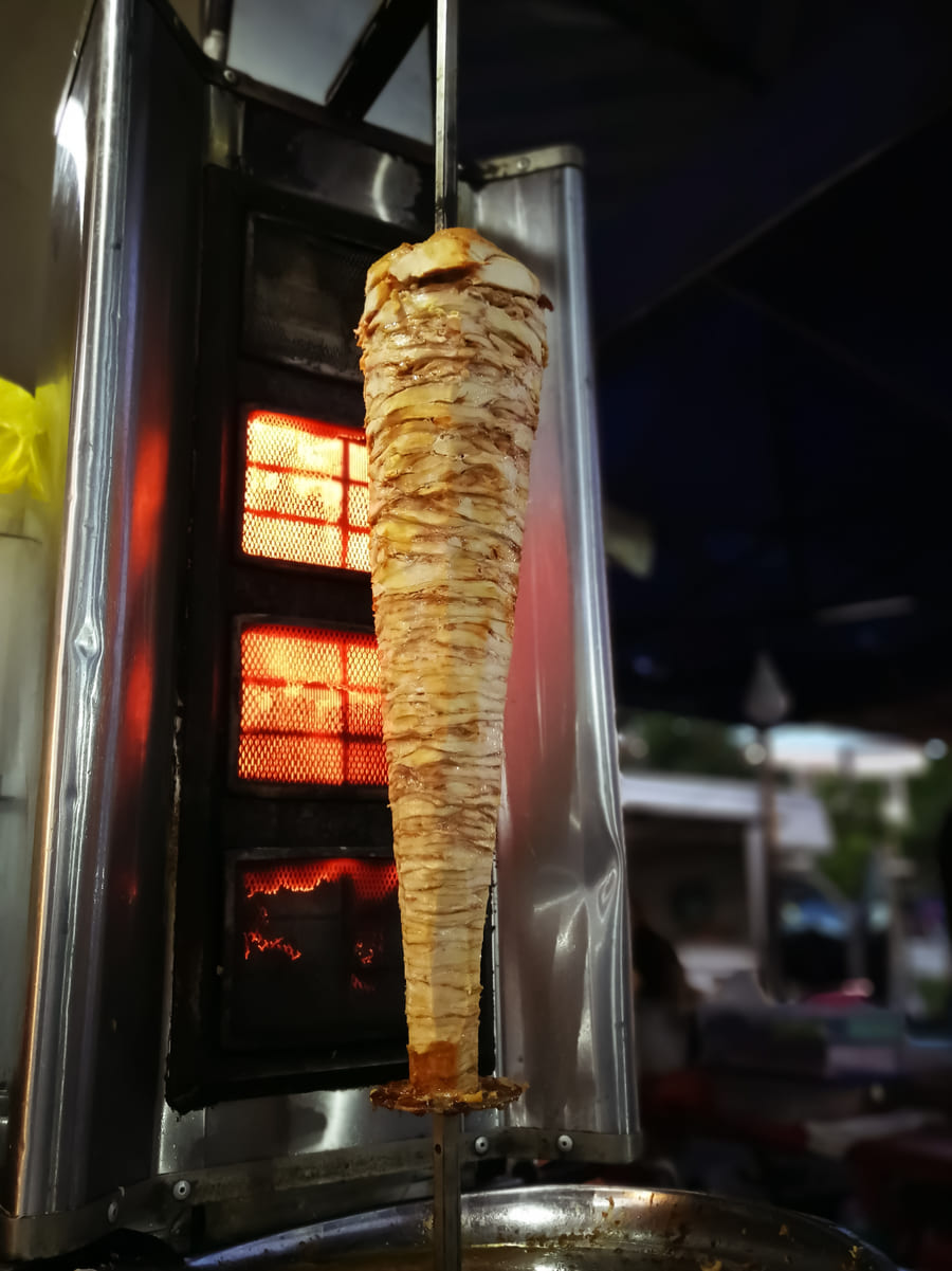 Al pastor spinning on the trompo with flame